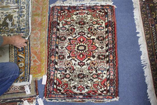 A pair of Persian blue ground small mats, decorated with animals amongst trees and flowers, and three other mats with stylised floral